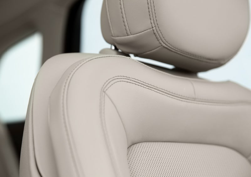 A detail shot of available leather-trimmed Perfect Position front seat shows off artistic details like luxe materials, precision stitching and supple curves | Loveland Lincoln in Loveland CO