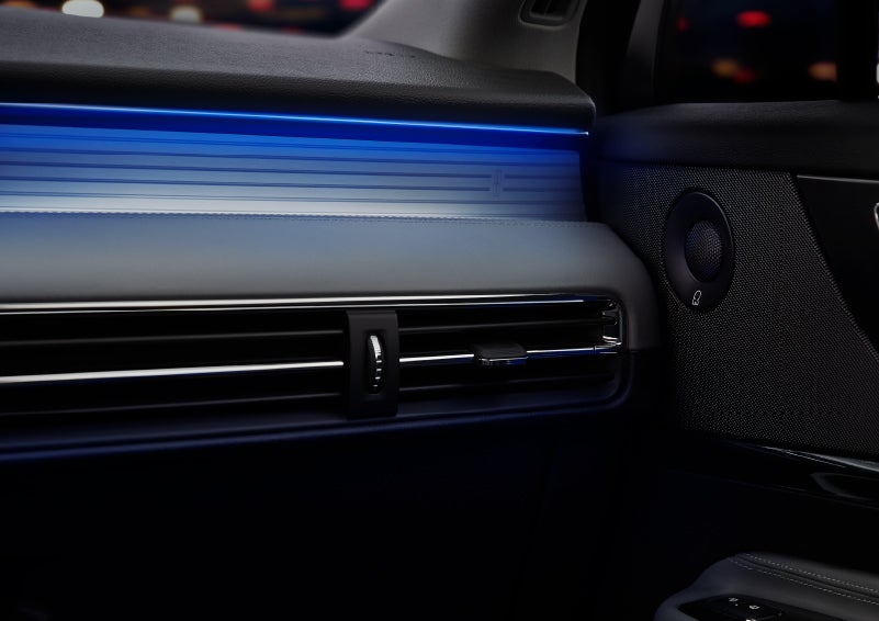 A thin available ambient blue lighting illuminates the pinstripe aluminum under an ebony dashboard, emitting a cool energy | Loveland Lincoln in Loveland CO