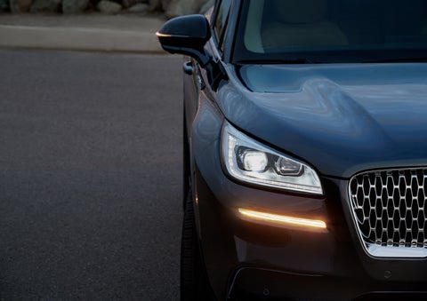 The turn signal on the front fascia is a bold sunset orange stroke of brilliance against a Flight Blue exterior | Loveland Lincoln in Loveland CO