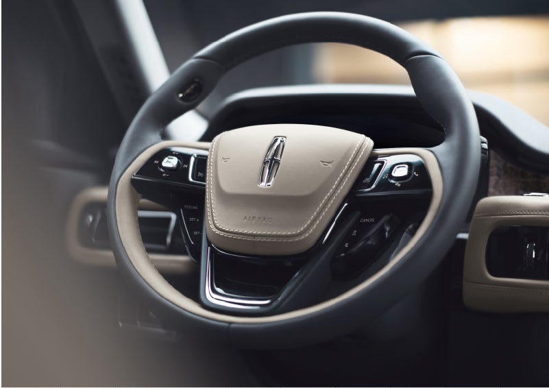 The intuitively placed controls of the steering wheel on a 2023 Lincoln Aviator® SUV | Loveland Lincoln in Loveland CO