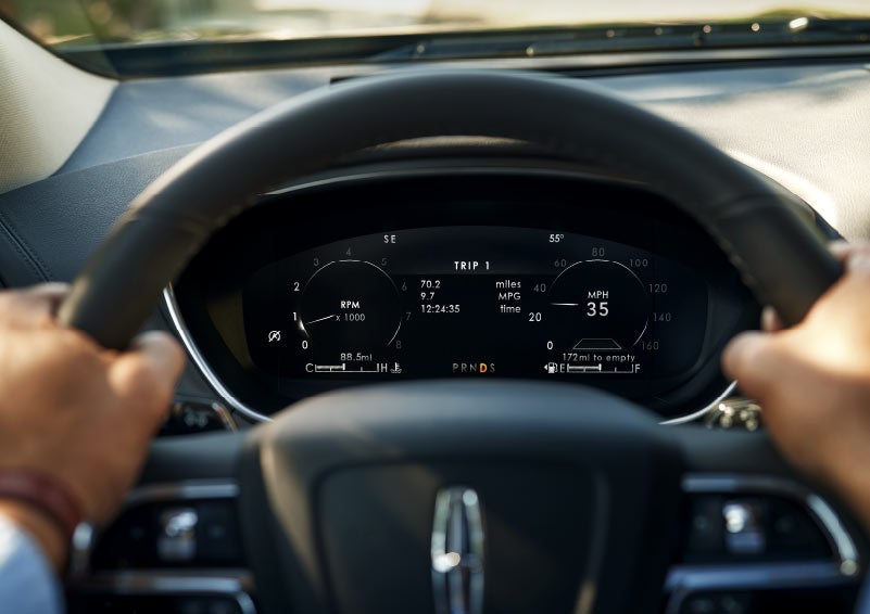 Information is displayed in the driver’s instrument cluster behind the steering wheel.