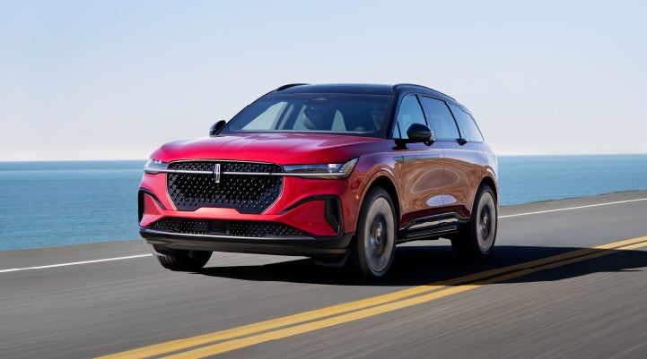 A 2024 Lincoln Nautilus® SUV is being driven on a seaside roadway. | Loveland Lincoln in Loveland CO