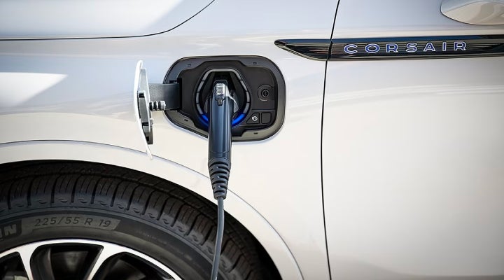 An electric charger is shown plugged into the charging port of a Lincoln Corsair® Grand Touring
model. | Loveland Lincoln in Loveland CO