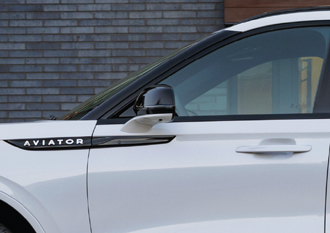 The driver’s door of a white 2025 Lincoln Aviator® SUV is showcased. | Loveland Lincoln in Loveland CO