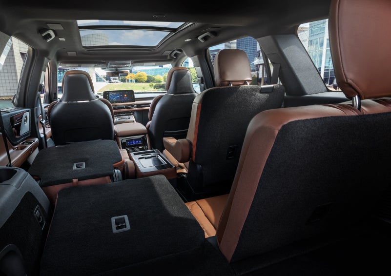 The interior of the 2025 Lincoln Aviator® SUV is shown with two seats folded down for added space. | Loveland Lincoln in Loveland CO