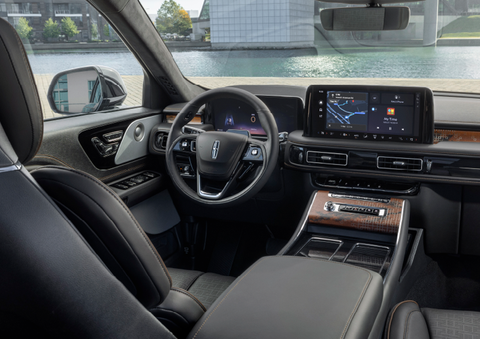 The interior of the 2025 Lincoln Aviator® SUV is shown parked with a view of a harbor through the windshield. | Loveland Lincoln in Loveland CO