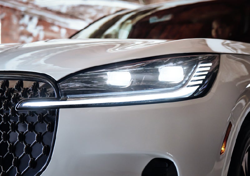 A close-up of a headlamp on the 2026 Lincoln Aviator® SUV is shown. | Loveland Lincoln in Loveland CO