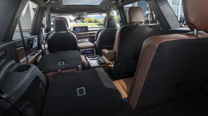One side of the PowerFold® third-row seat and a second-row seat are folded forward in the 2026 Lincoln Aviator® SUV. | Loveland Lincoln in Loveland CO