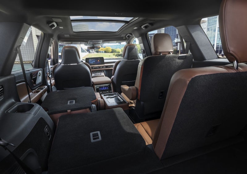 One side of the PowerFold® third-row seat and a second-row seat are folded forward in the 2026 Lincoln Aviator® SUV. | Loveland Lincoln in Loveland CO