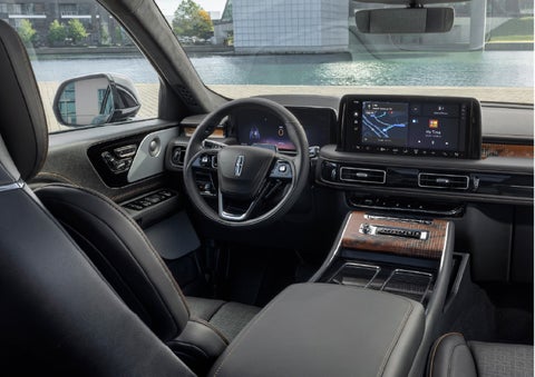 The interior of the 2026 Lincoln Aviator® SUV is shown parked with a view of a harbor through the windshield. | Loveland Lincoln in Loveland CO