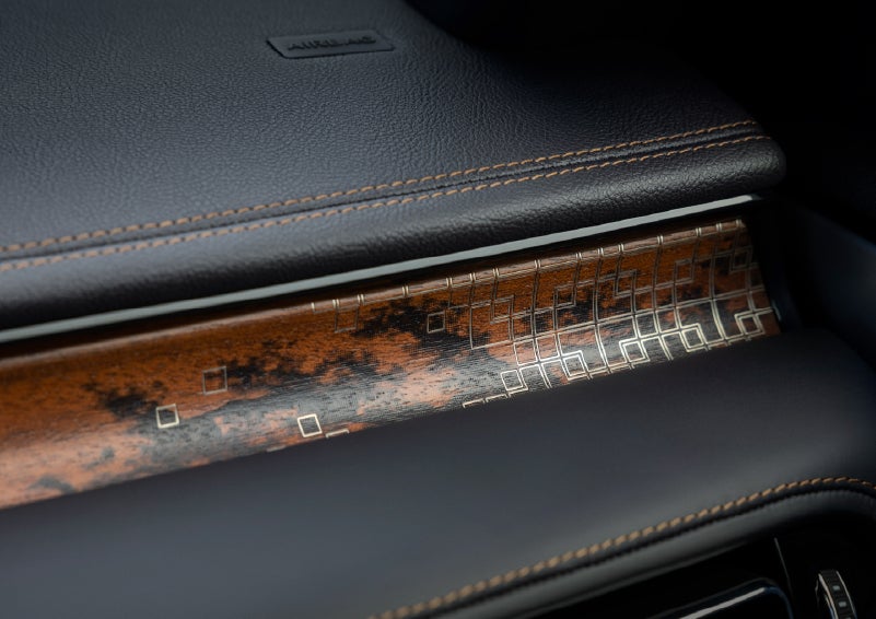 A close-up shot of the 2026 Lincoln Aviator® dashboard with unique black and brown accents and brown stitching. | Loveland Lincoln in Loveland CO