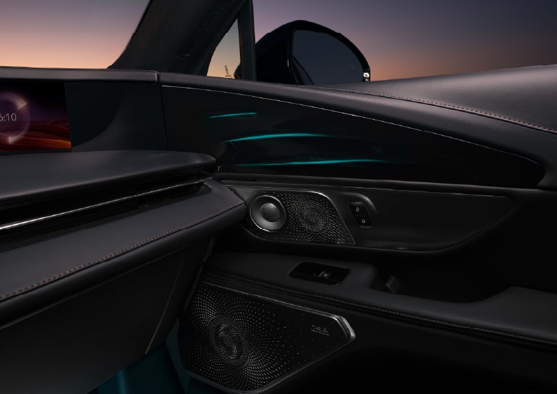 Selectable ambient lighting glows in the passenger door panel. | Loveland Lincoln in Loveland CO