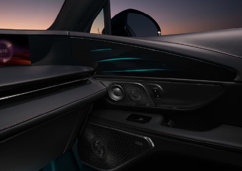 Selectable ambient lighting glows in the passenger door panel. | Loveland Lincoln in Loveland CO