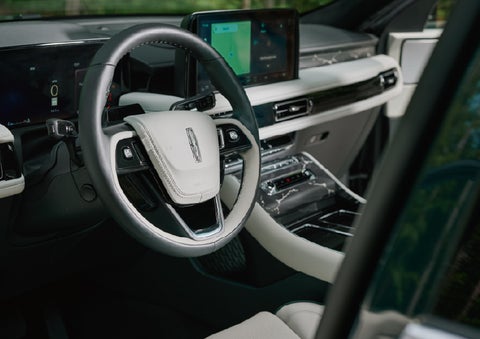 The leather-trimmed steering wheel of a 2027 Lincoln Aviator® Black Label™ SUV. | Loveland Lincoln in Loveland CO