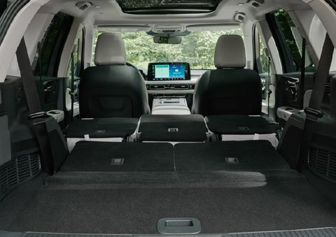 A rear to front view of the interior of a 2027 Lincoln Aviator® Black Label™ SUV shows the third and second rows folded flat | Loveland Lincoln in Loveland CO